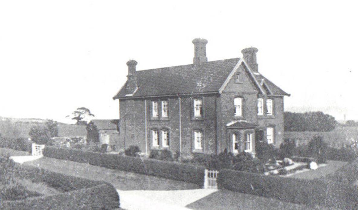 A black and white photo of a house and some trees
Description automatically generated with low confidence